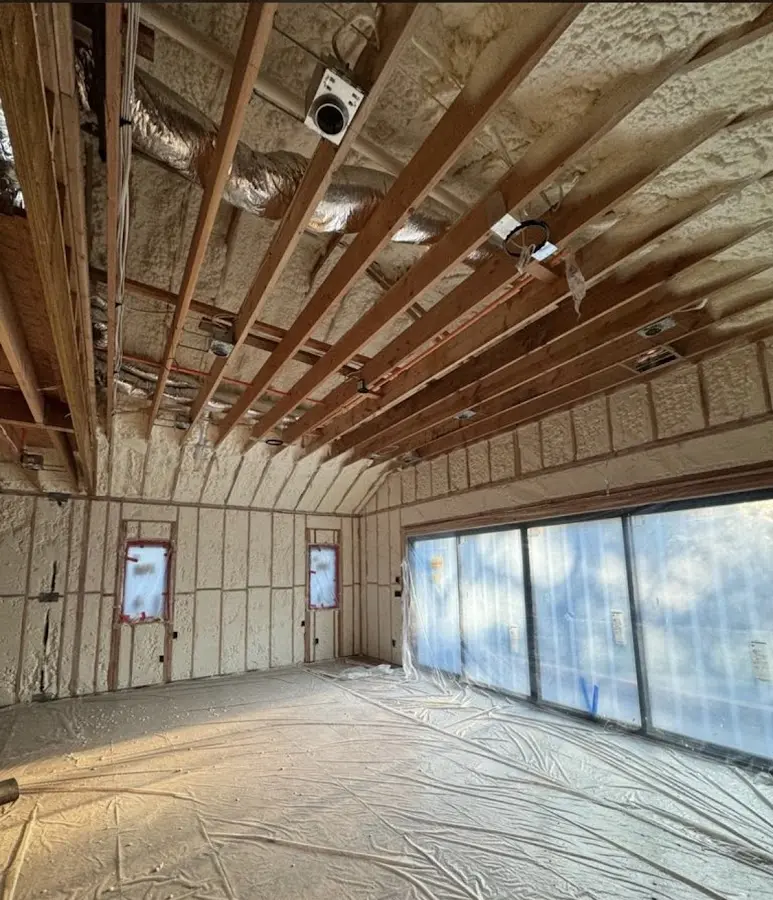 Interior walls and ceiling insulated with spray foam during new construction in Forest Park